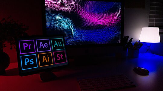 Imagem com um computador com aplicativos da empresa Adobe