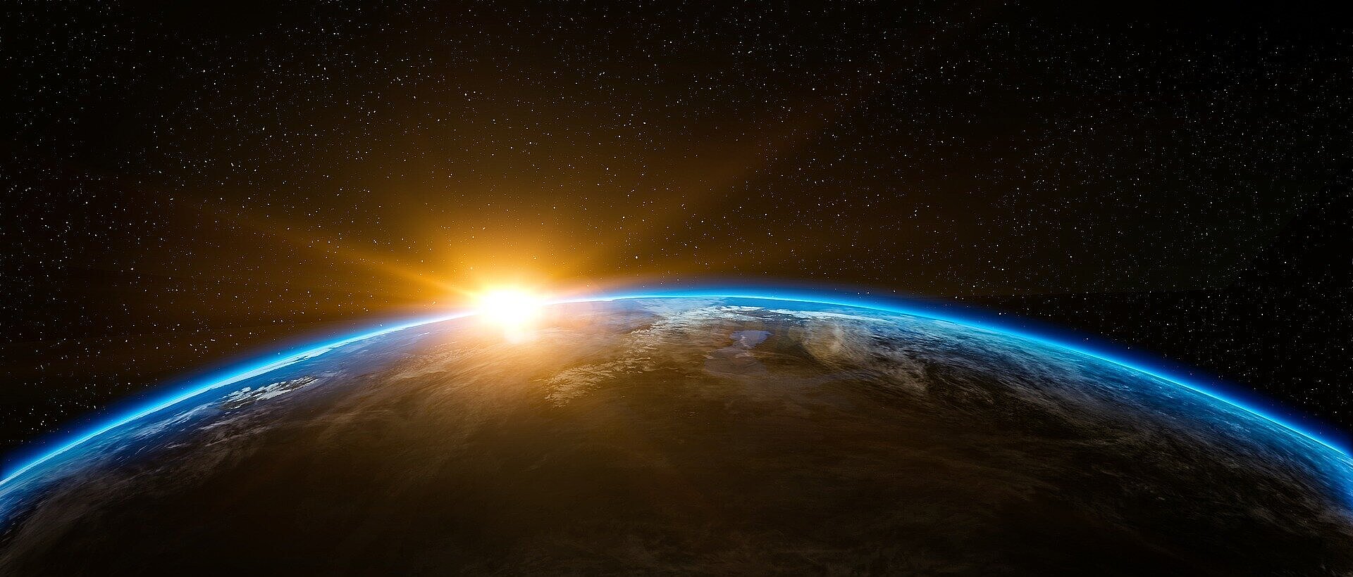 Planeta Terra visto de longe, com Sol ao fundo.